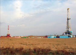 Figure 2: Cell phones were used to communicate between the relief well rig (foreground) and the problem well rig (background).