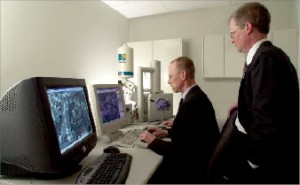 BJ Services Geological Laboratories manager B.J. Davis (left) and manager of shale technology Randy LaFollette review rock formation properties with a high-magnification environmental scanning electron microscope at the company’s Technology and Operations Support Center in Tomball, Texas.