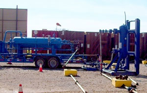 A sand separator filters out any sand, sending it through a 2-inch pipe into the disposal tank, and leaves a mixture of natural gas and water.