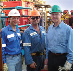 Jim Nowotny (from left) in his role as the Atwood Eagle operations  manager; Jason Johns, lead roustabout; and John Irwin, former Atwood  president/CEO, work on the Atwood Eagle semi. 