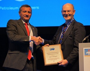 Left to right: 2011 SPE President Alain Labastie presents the 2011 SPE Drilling Engineering Award to Dr John Thorogood.