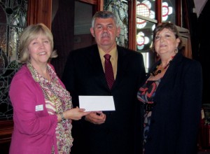 CLAN chief executive Debbie Thomson (left) receives a £4,400 check from Glenn White (center), IADC North Sea Chapter chairman, and Val Hood, NSC office administrator.