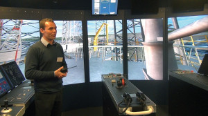 Michael Toftelund, Maersk Training Svendborg maritime instructor, explains the functions of the rig control room simulator at the MOSAIC II. The simulator allows students to test their ability to apply knowledge they’ve learned in the classroom before going back into the workplace.