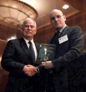 On behalf of the IADC Jackup Rig Committee, David Lewis (left) of Lewis Engineering Group accepts the award from the association’s president and CEO Stephen Colville in Houston on 5 February.