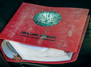 A well-used 11th-edition of the IADC Drilling Manual sits on the front seat of a truck at a wellsite in the Permian Basin. IADC plans to issue the new 12th edition in 2014 in both print and digital formats; the latter will incorporate videos and animations.