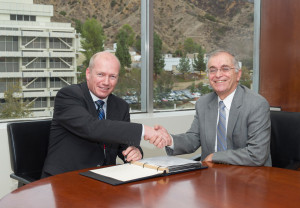 Lars Hoier (left) senior vice president, research, development and innovation for Statoil, and Dr Charles Elachi, director, NASA/JPL-Caltech, seal the partnership agreement to study how technologies and expertise from the space industry can benefit the oil and gas industry as it pushes into new frontier regions, such as the Arctic.