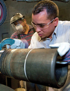 A TSC Drill Pipe employee conducts an in-process dimensional inspection of drill pipe weld-neck using a snap gauge, a precision inspection tool that provides quick verification of diameter, at a TSC manufacturing facility in Houston. Weld-neck is the location on the drill pipe where the drill pipe tool joint is welded to the drill pipe body.