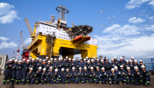 The Frigstad Shekou and the Frigstad site supervision and operations team at Yantai CIMC Raffles Offshore.  The Frigstad Shekou is the first of two ultra-deepwater semisubmersible rigs ordered by Frigstad Deepwater in December 2012.