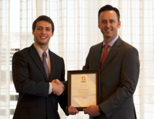 IADC President Jason McFarland (right) presented Corey Wittig, a senior at Texas A&M University and Chairman of the A&M Student Chapter, with a certificate of organization for the chapter. The chapter will hold its first meeting on 13 February on the A&M campus.