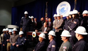 Secretary of the Department of the Interior Ryan Zinke signs two secretarial orders aimed at unleashing America's offshore energy potential and growing the US economy at the 2017 OTC in Houston. 