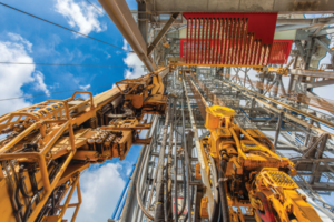 NOV’s TDX 1250 top drive and Hydraracker pipe-handling system are pictured aboard the Noble Tom Madden drillship. The company is working to create an entire drilling ecosystem that encompasses the downhole, as well as topside equipment such as these. 