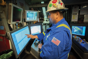 A driller on Precision’s Rig 601 sets parameters for the Process Automation Control system. When the system was run in a pilot program in the Permian Basin, it improved connection times by 30% compared with a driller executing the process manually. 